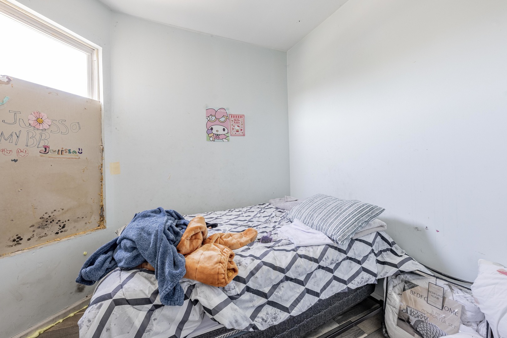 1638 South Pulaski Road Chicago, IL 60623 - Photo 15 of 22 a bedroom with a bed and a wall painting