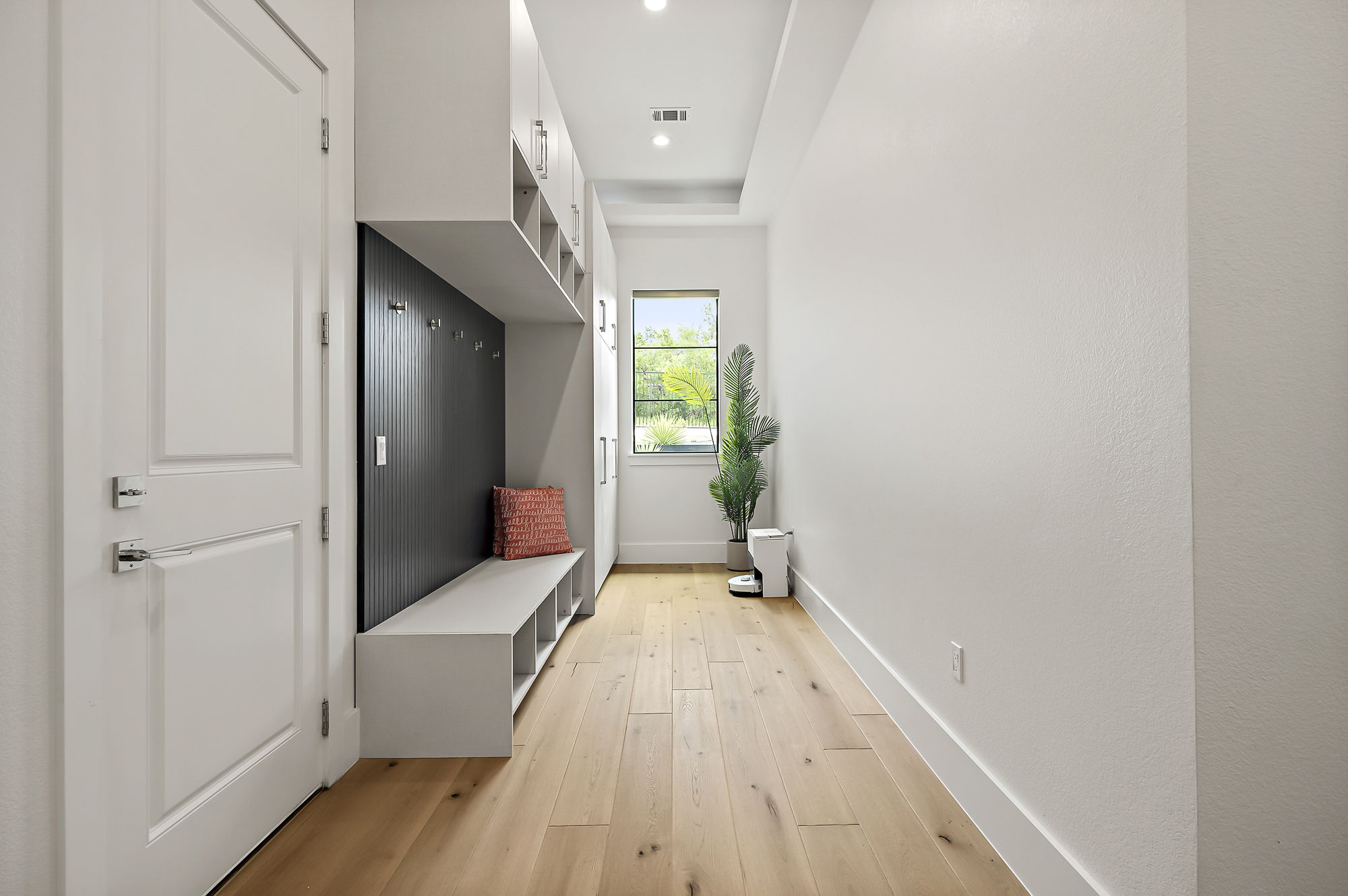 10211 Thistle Ridge Austin, TX 78733 - Photo 17 of 39 Mudroom featuring light wood-style flooring, baseboards, and recessed lighting