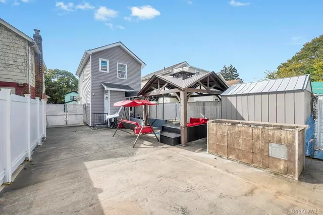 a view of a houses with wooden fence