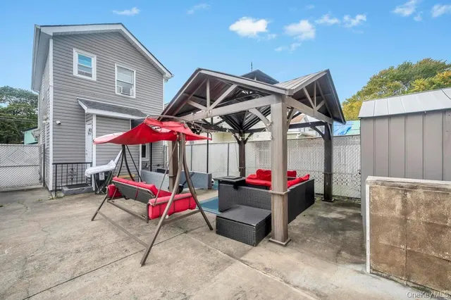 a wooden bench sitting in front of a house