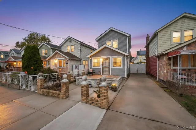 a front view of a house with sitting area