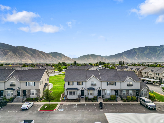 983 South 1850th Street West Springville, UT 84663 - Photo 22 of 30 Townhome community featuring a stucco and stone facade, dark shingle roofs, and individual front entrances