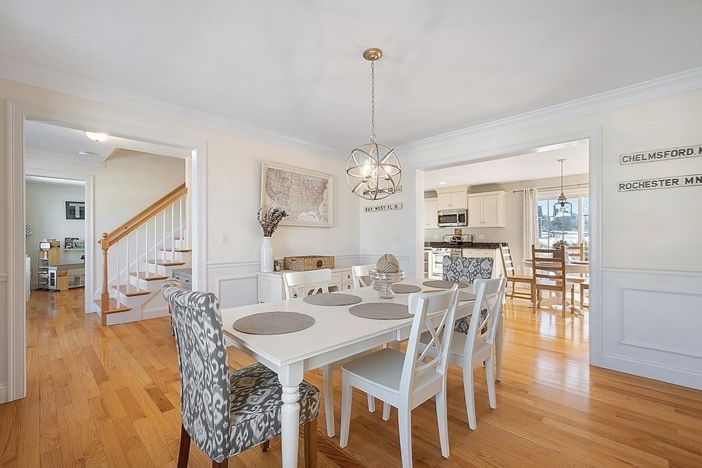 21 Butternut Road Dracut, MA 01826 - Photo 11 of 28 a view of a dining room with furniture wooden floor and chandelier