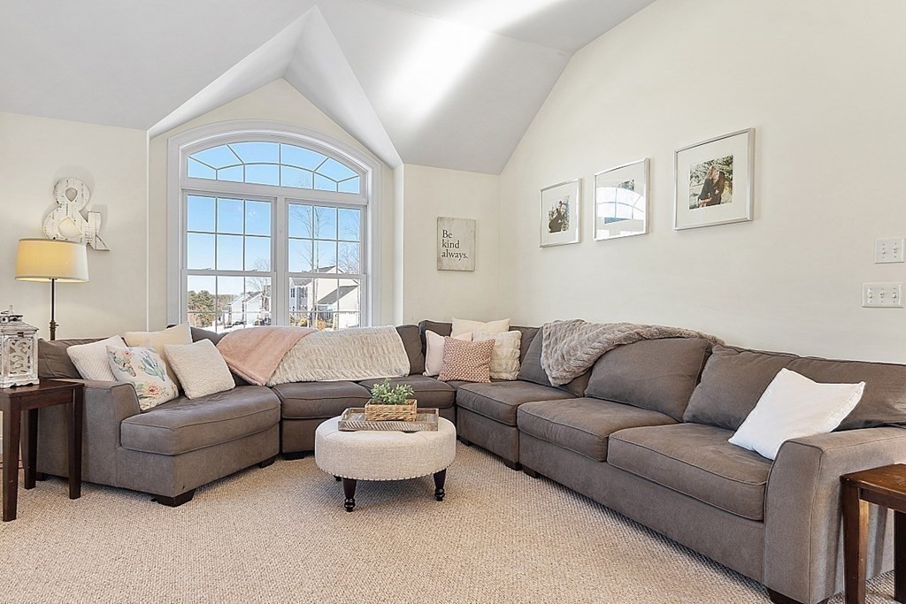 21 Butternut Road Dracut, MA 01826 - Photo 13 of 28 a living room with furniture and a large window