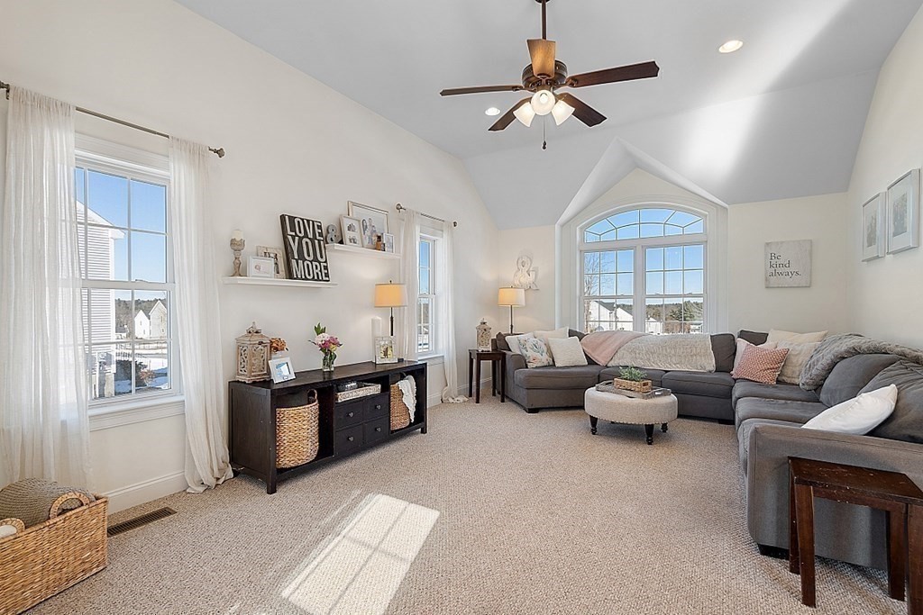 21 Butternut Road Dracut, MA 01826 - Photo 14 of 28 a living room with furniture ceiling fan and a window