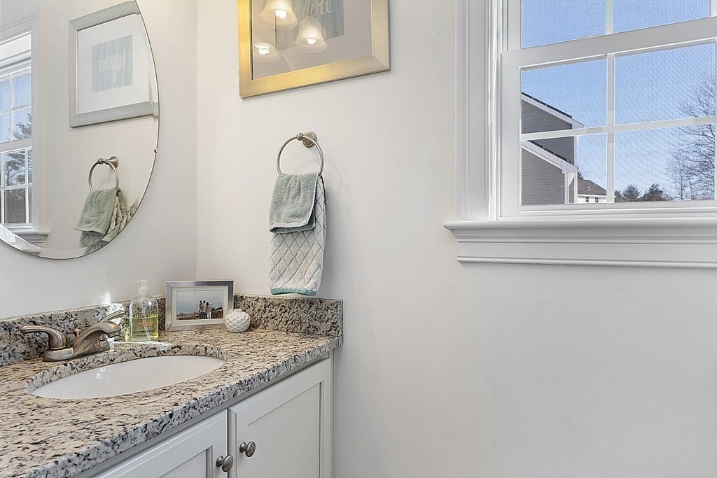 21 Butternut Road Dracut, MA 01826 - Photo 17 of 28 a bathroom with a granite countertop sink and a mirror