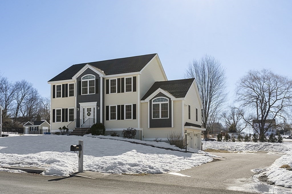 21 Butternut Road Dracut, MA 01826 - Photo 2 of 28 a front view of a house with a yard
