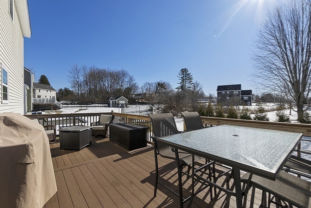 21 Butternut Road Dracut, MA 01826 - Photo 25 of 28 a view of a roof deck with couches and wooden floor