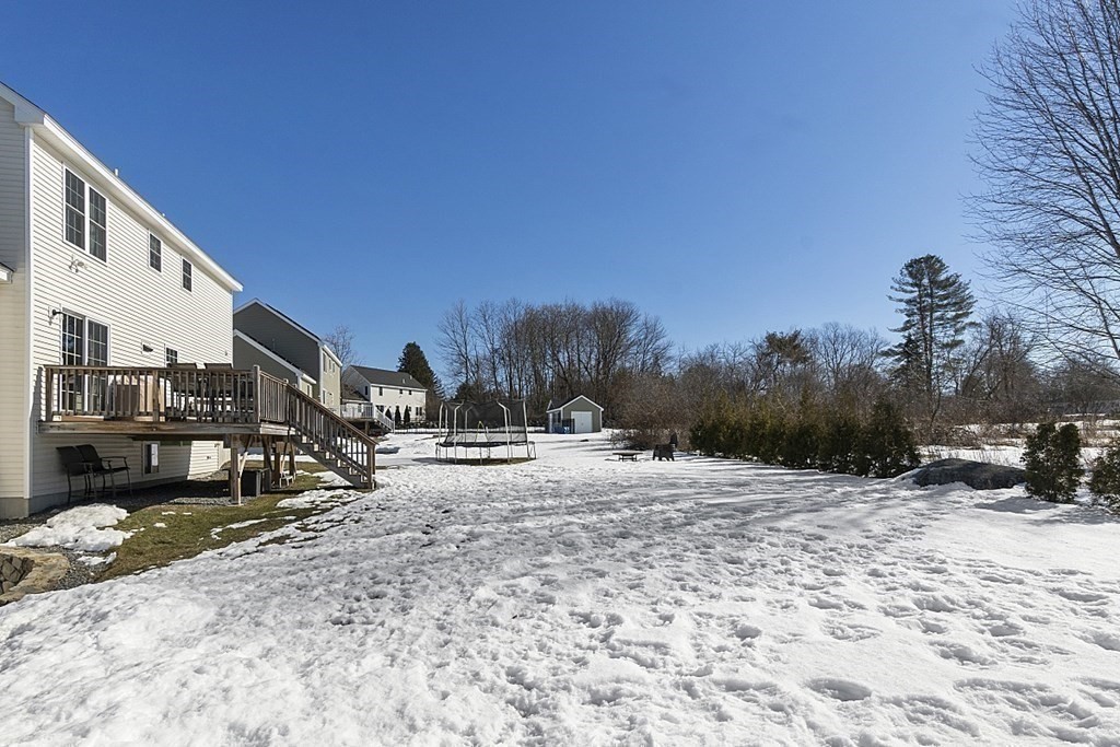 21 Butternut Road Dracut, MA 01826 - Photo 28 of 28 a view of a dry yard with snow on the road