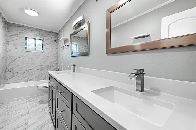 a bathroom with a sink and a bathtub