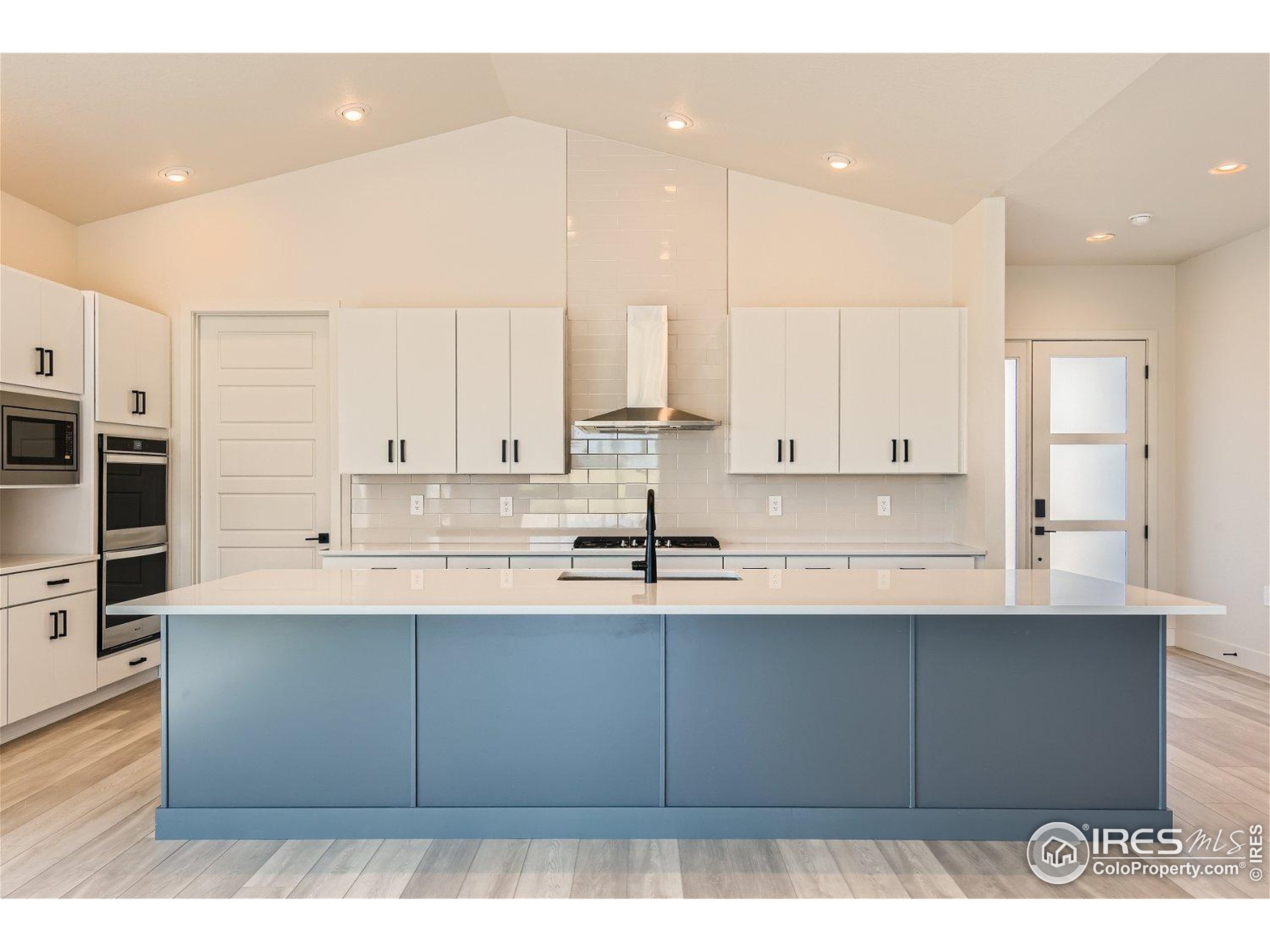 1726 Morningstar Way Fort Collins, CO 80524 - Photo 11 of 29 a kitchen with stainless steel appliances granite countertop a sink a stove and a refrigerator