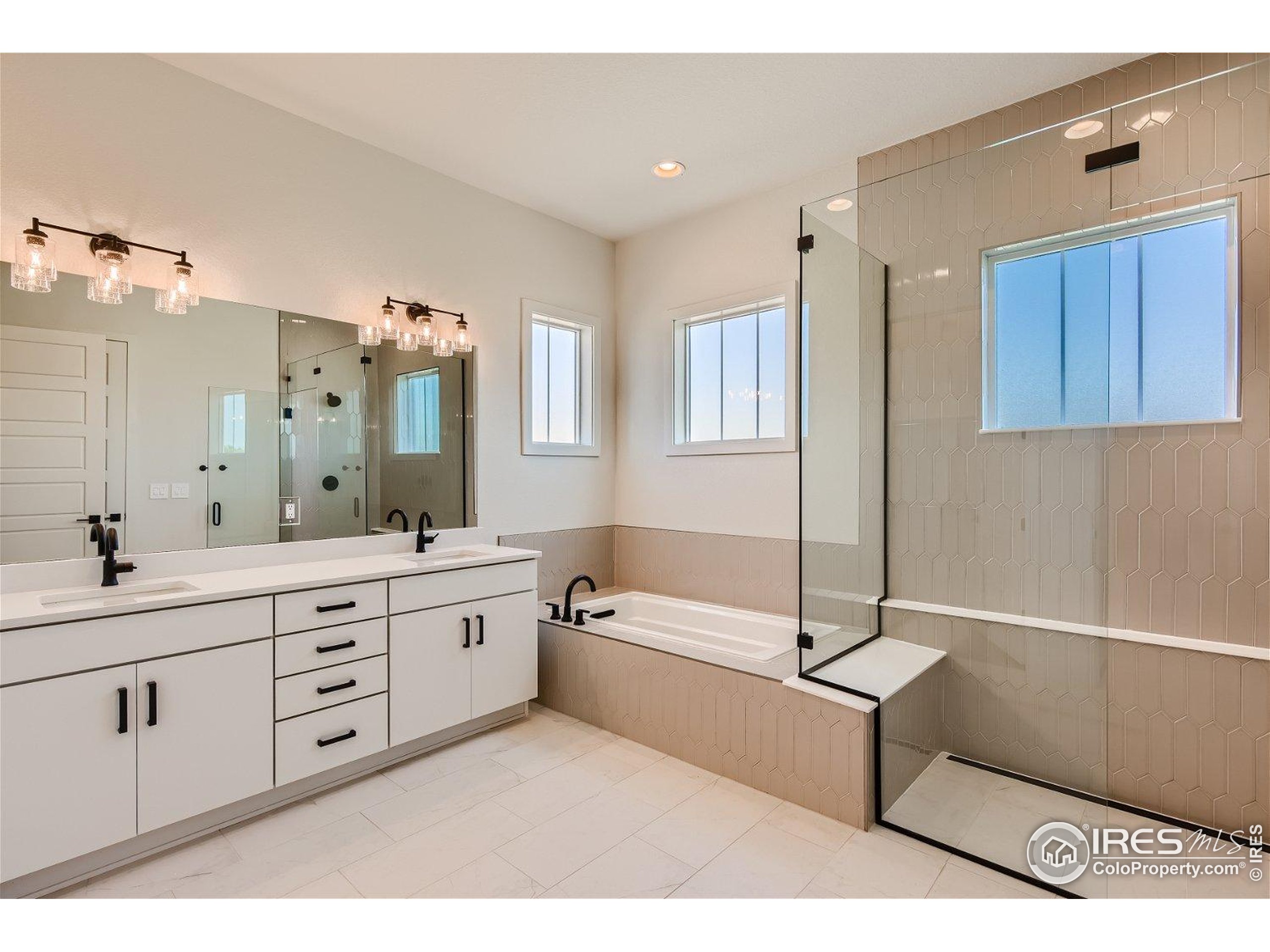 1726 Morningstar Way Fort Collins, CO 80524 - Photo 15 of 29 a spacious bathroom with a tub sink and mirror