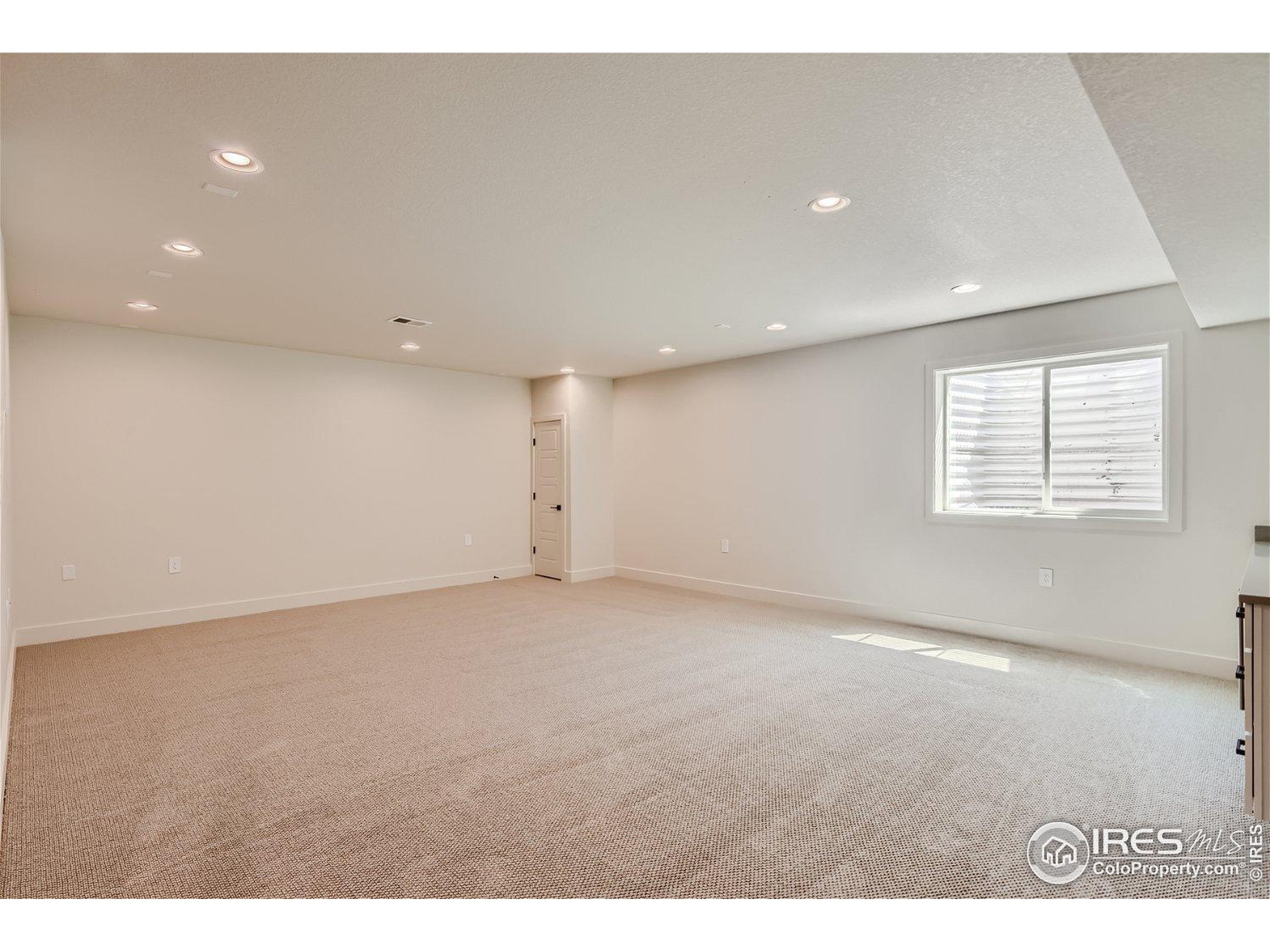 1726 Morningstar Way Fort Collins, CO 80524 - Photo 21 of 29 a view of an empty room with a window