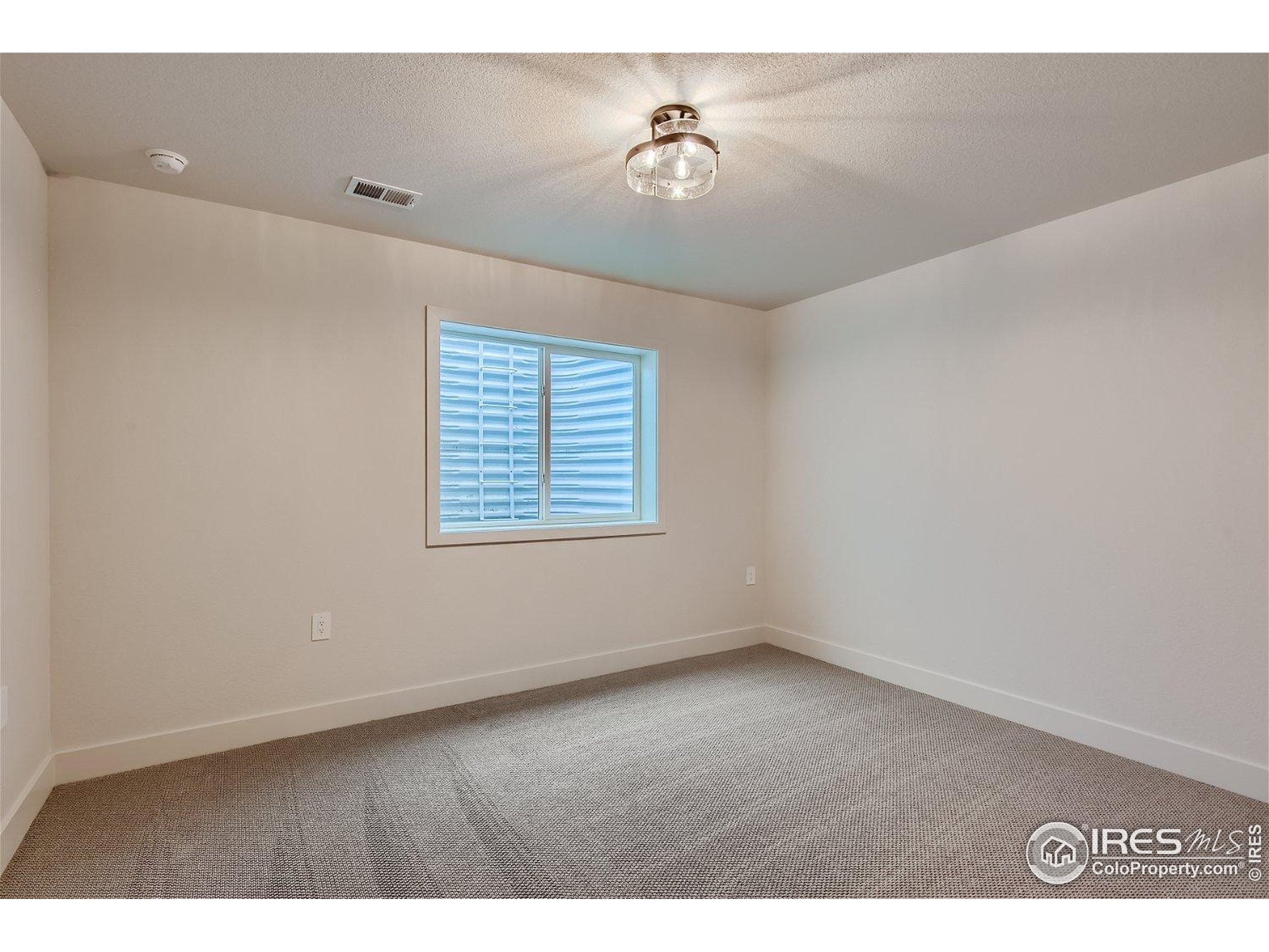 1726 Morningstar Way Fort Collins, CO 80524 - Photo 22 of 29 a view of an empty room with a window