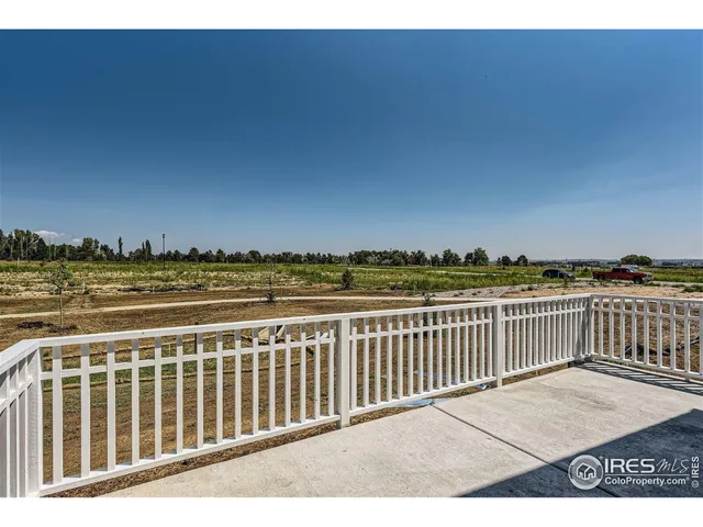 a living room with furniture and lamp