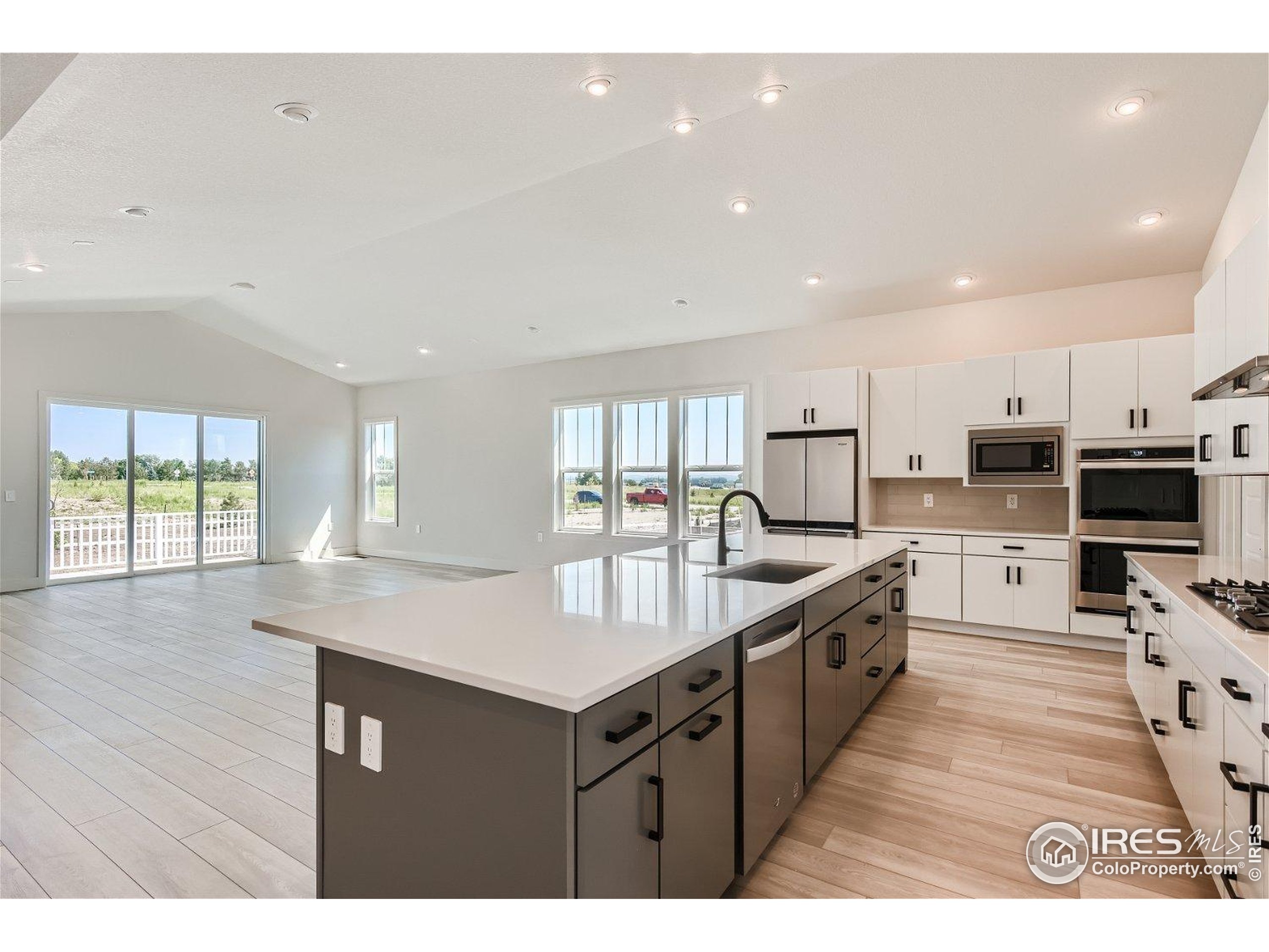 1726 Morningstar Way Fort Collins, CO 80524 - Photo 6 of 29 a kitchen with counter top space cabinets and appliances