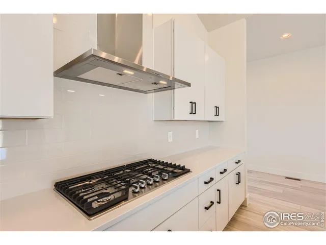 a bathroom with a sink a mirror and shower