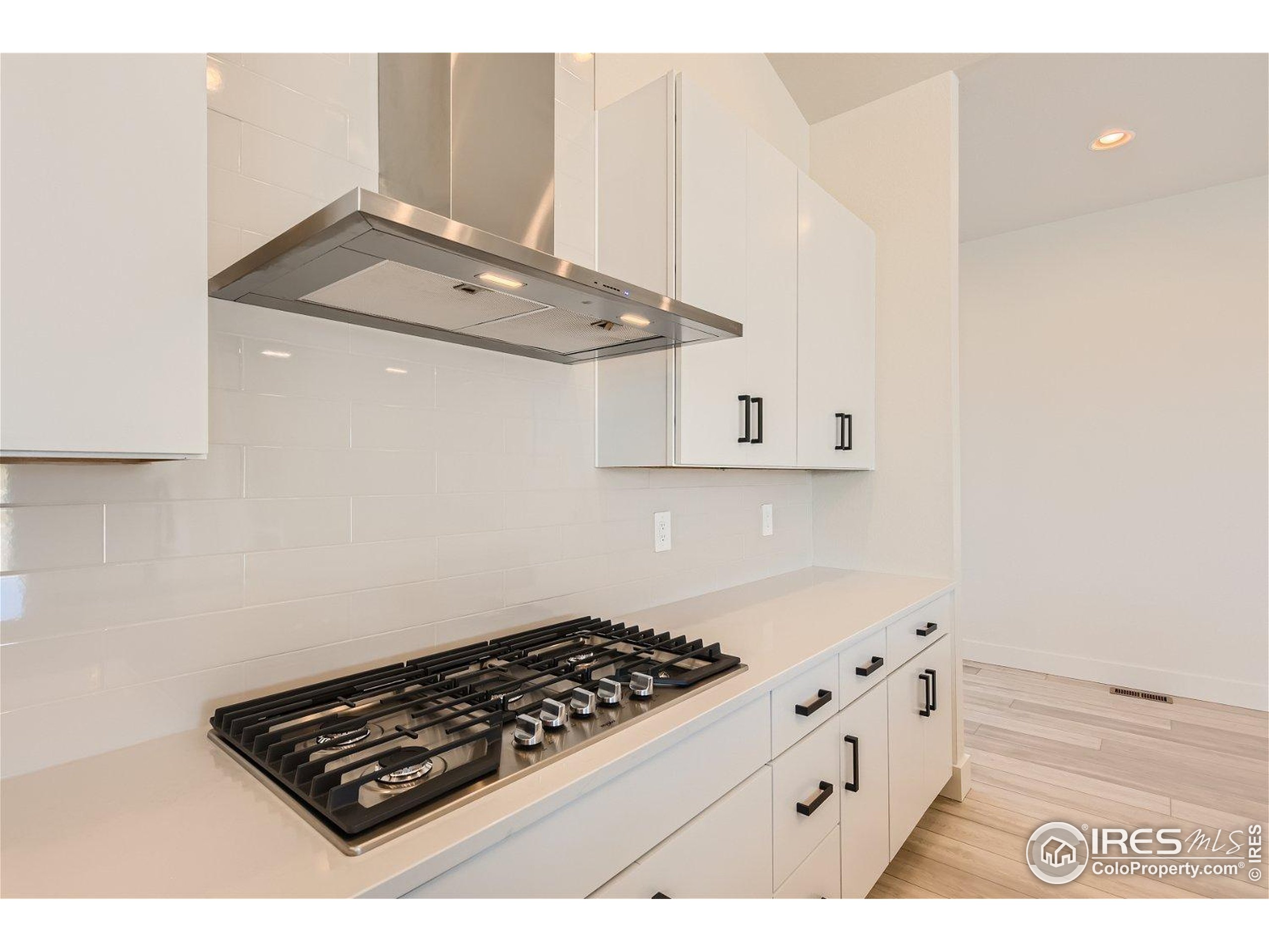 1726 Morningstar Way Fort Collins, CO 80524 - Photo 9 of 29 view of kitchen island with stove and cabinets