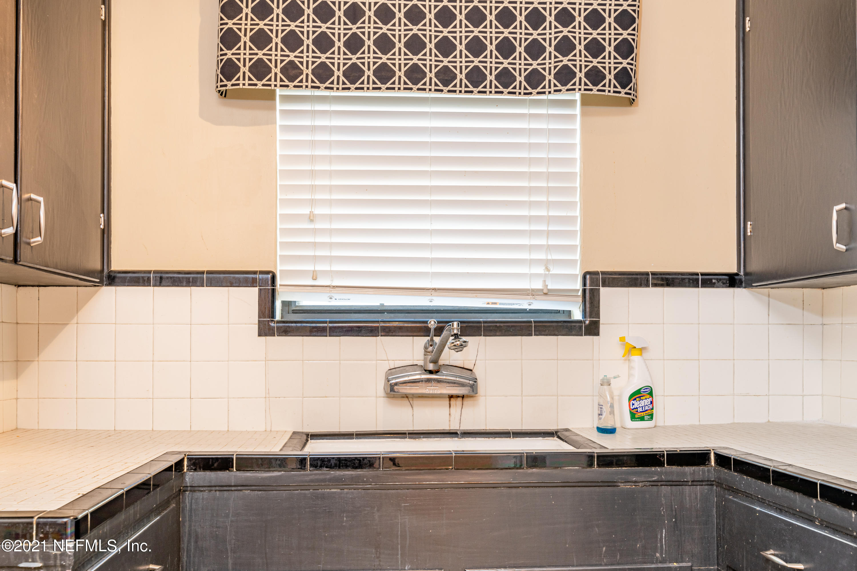 2340 Bayview Road Jacksonville, FL 32210 - Photo 12 of 33 a bathroom with a sink and a window