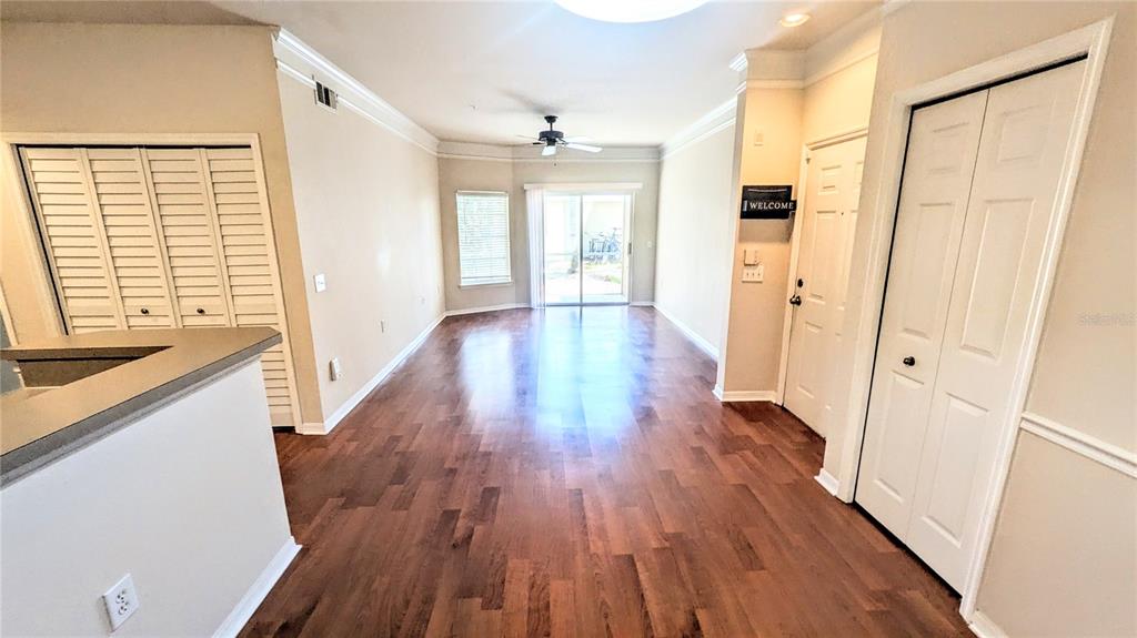 5174 Northridge Road, Unit 102 Sarasota, FL 34238 - Photo 5 of 39 wooden floor in an empty room with a window