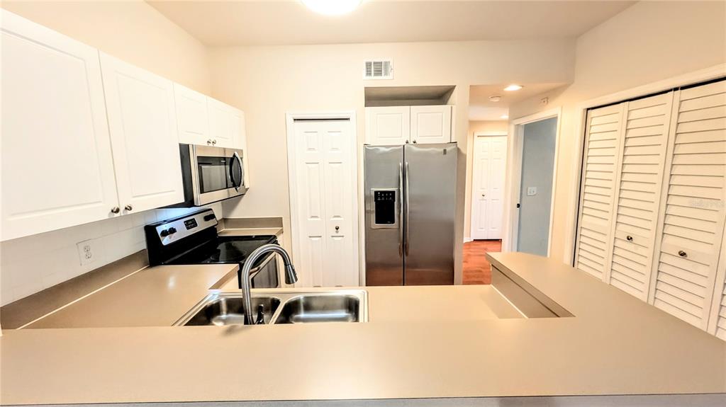 5174 Northridge Road, Unit 102 Sarasota, FL 34238 - Photo 7 of 39 a bathroom with a sink a bathtub and a mirror