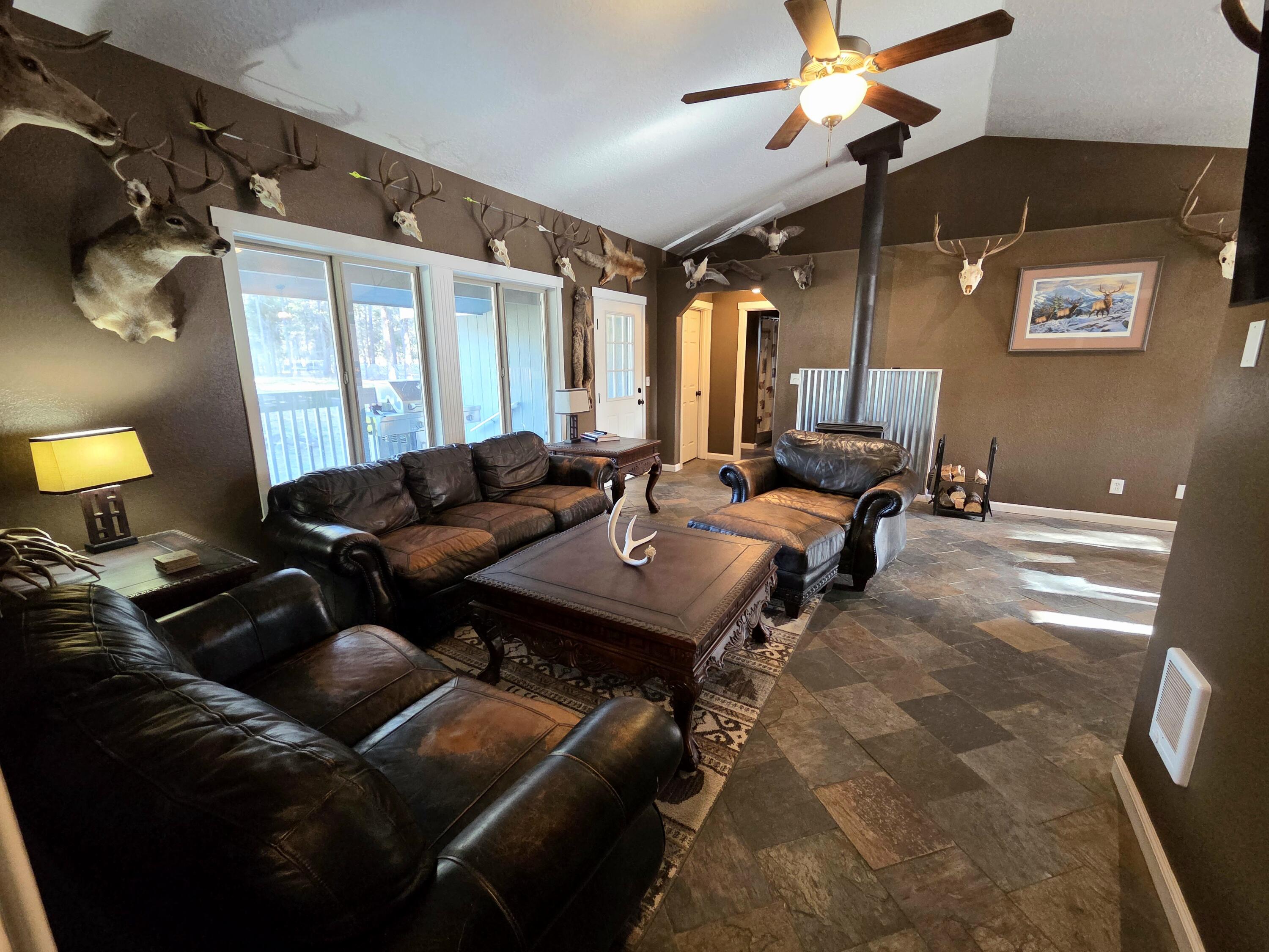 53156 Day Road La Pine, OR 97739 - Photo 12 of 28 Living Room area, open floor concept, vaulted ceilings, and wood heat.
