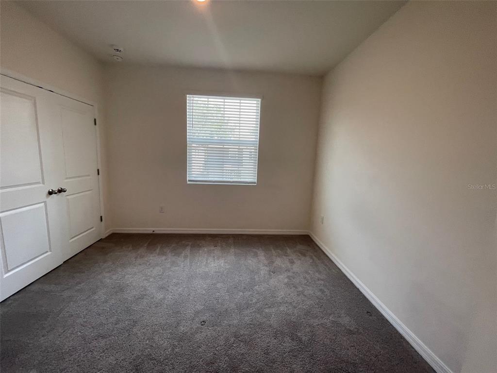 13808 Northwest 9th Road Newberry, FL 32669 - Photo 13 of 24 an empty room with a window