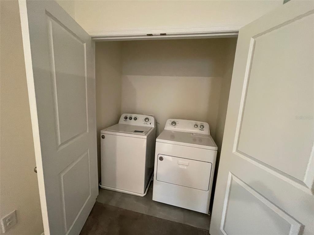 13808 Northwest 9th Road Newberry, FL 32669 - Photo 16 of 24 a utility room with dryer and washer