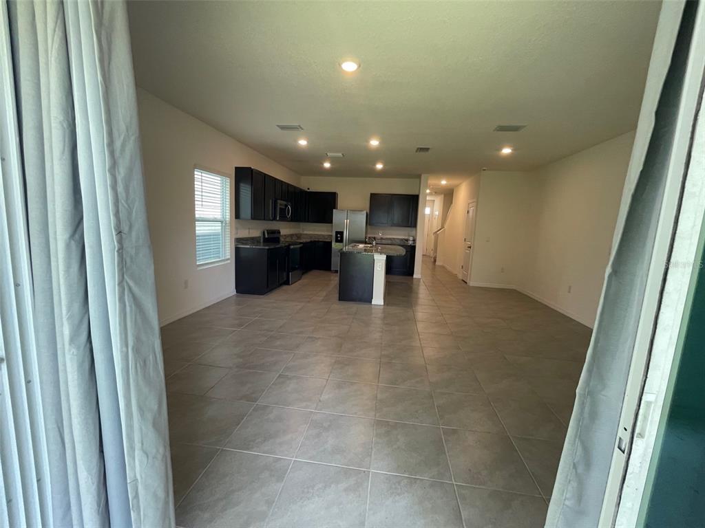 13808 Northwest 9th Road Newberry, FL 32669 - Photo 2 of 24 a view of a kitchen with a sink and cabinets