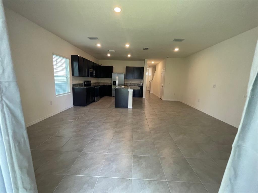 13808 Northwest 9th Road Newberry, FL 32669 - Photo 21 of 24 a view of a kitchen with a sink and microwave