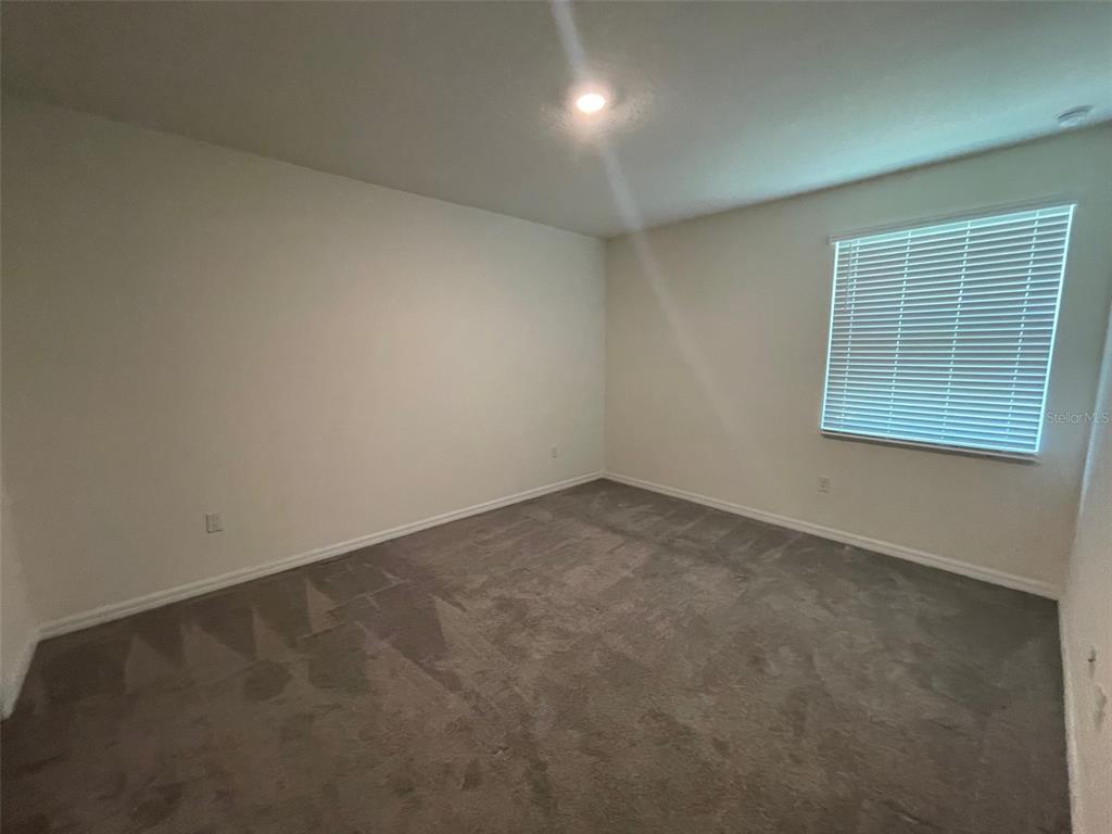 13808 Northwest 9th Road Newberry, FL 32669 - Photo 8 of 24 an empty room with a window