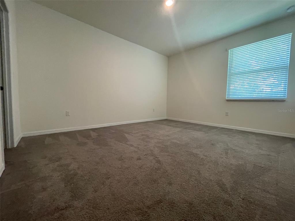 13808 Northwest 9th Road Newberry, FL 32669 - Photo 9 of 24 an empty room with windows