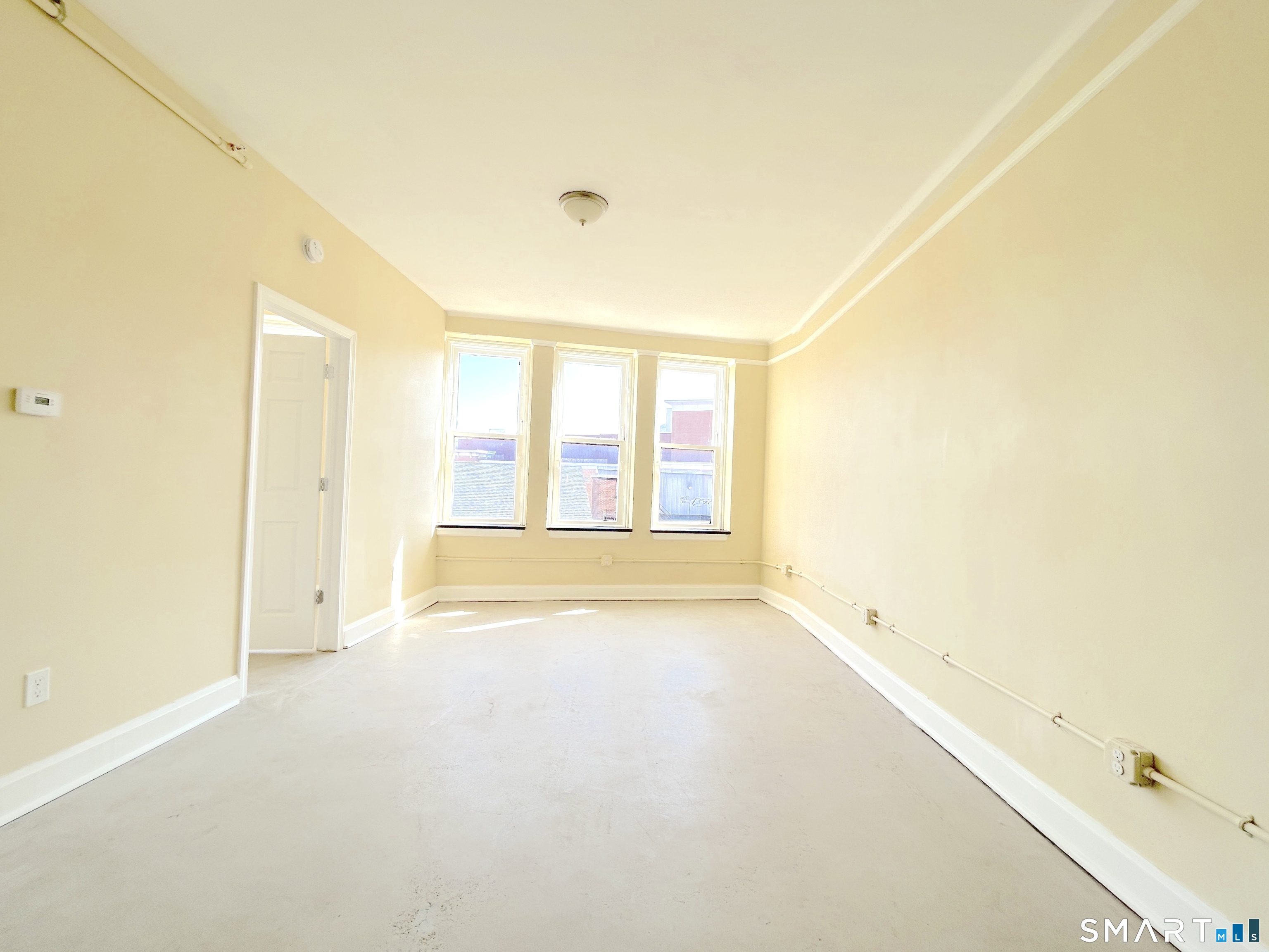 77 Bank Street, Unit 2B Waterbury, CT 06702 - Photo 3 of 11 a view of an empty room with a window