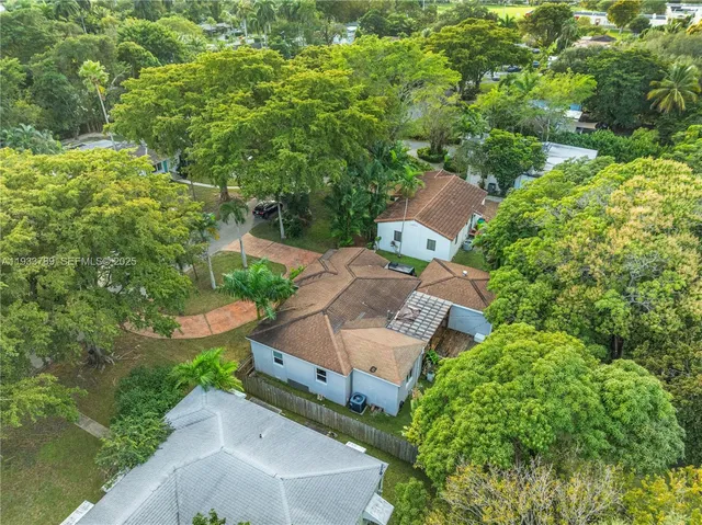 an aerial view of a house with a garden