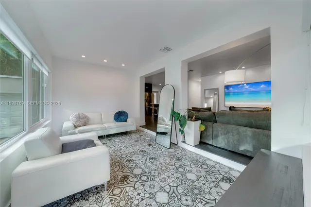 a living room with furniture and a table