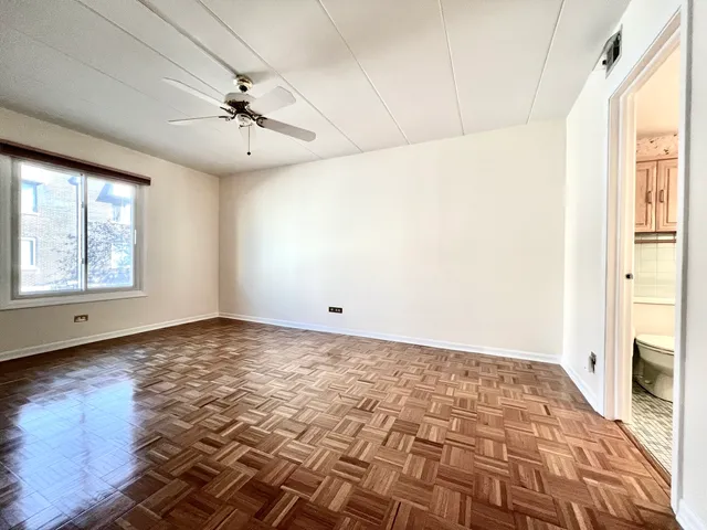 a view of an empty room and window