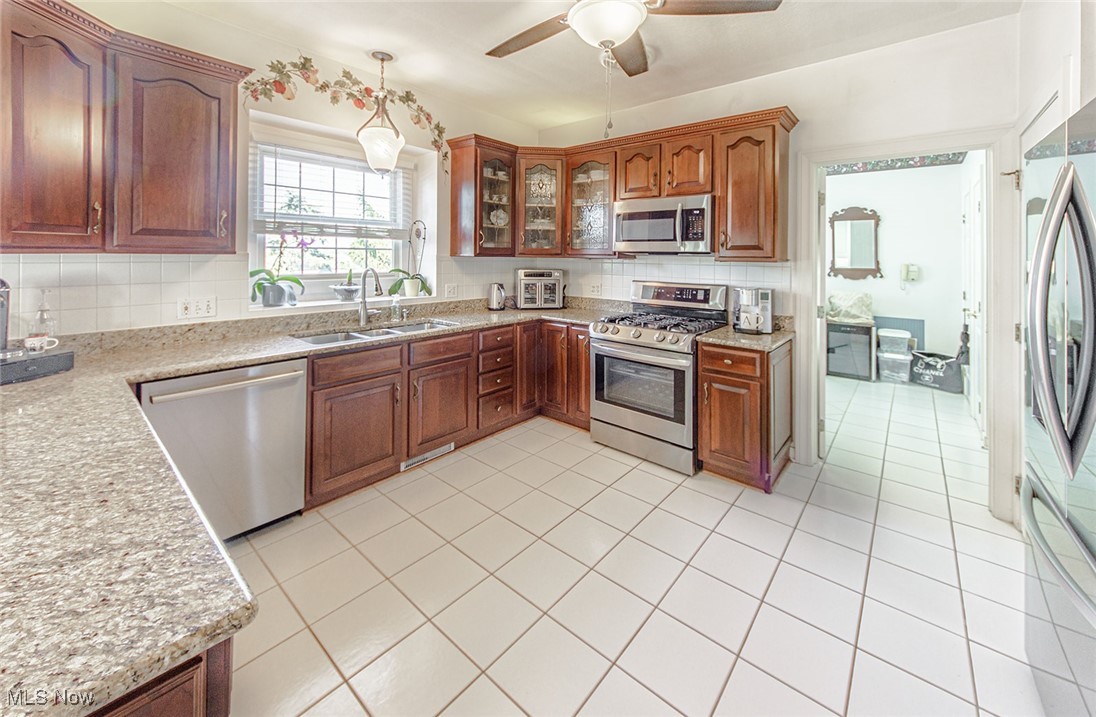 3451 Stanley Road Akron, OH 44333 - Photo 7 of 42 Neutral granite counter tops and stainless appliances