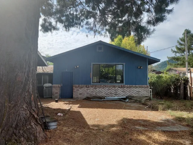 a backyard of a house with dishwasher oven and outdoor seating