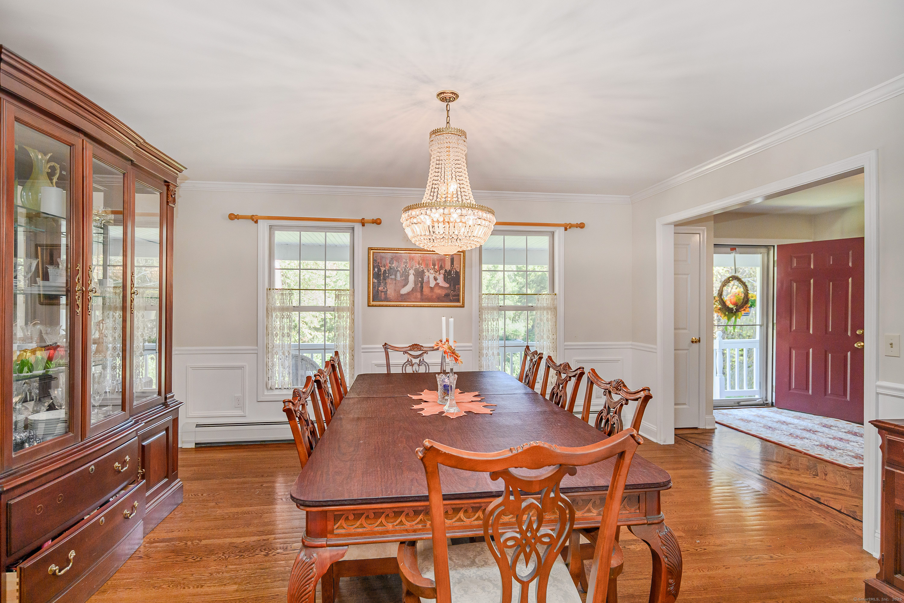 27 Pole Bridge Road Newtown, CT 06482 - Photo 14 of 39 a view of a dining room with furniture window and wooden floor