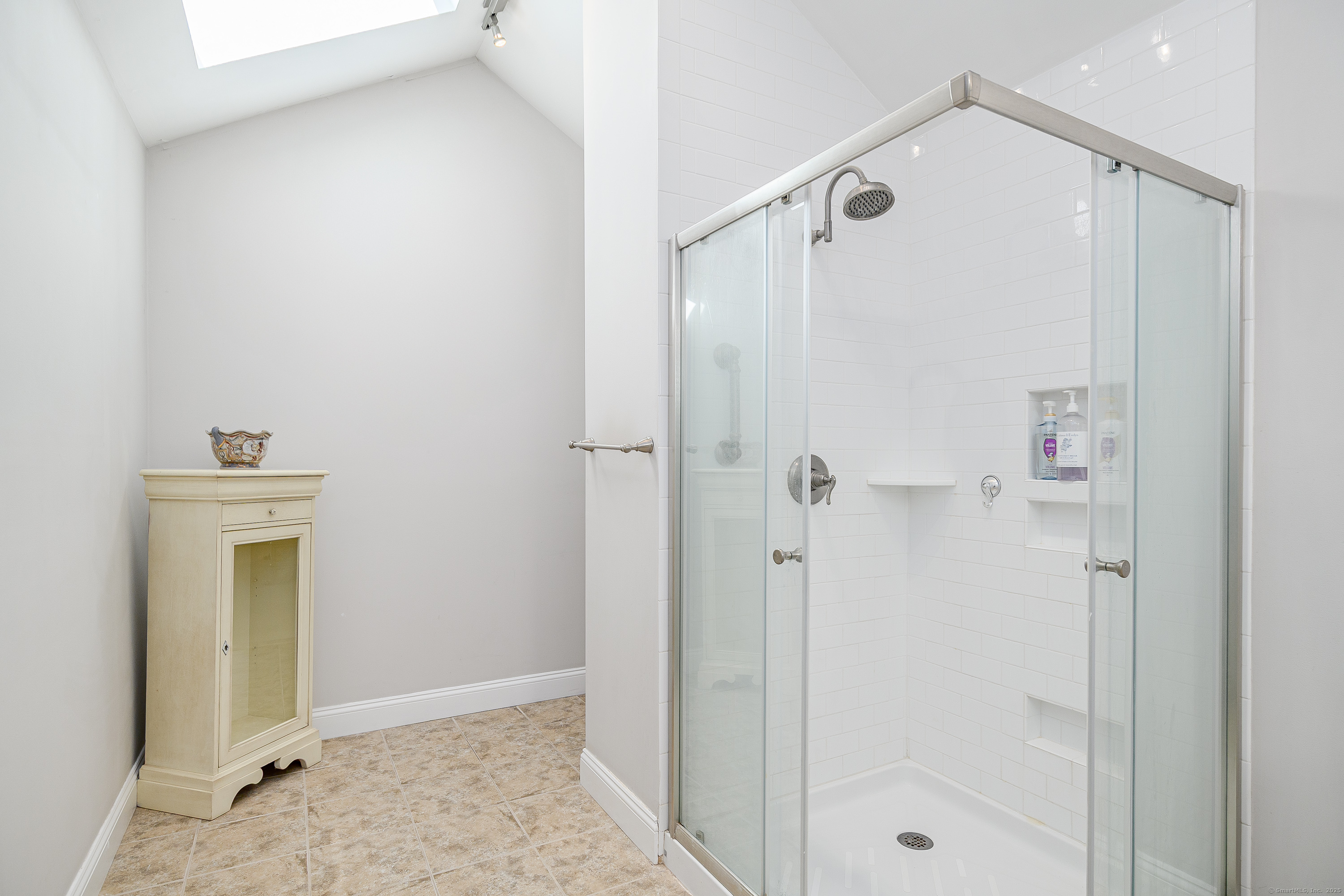 27 Pole Bridge Road Newtown, CT 06482 - Photo 29 of 39 a bathroom with a shower and a sink