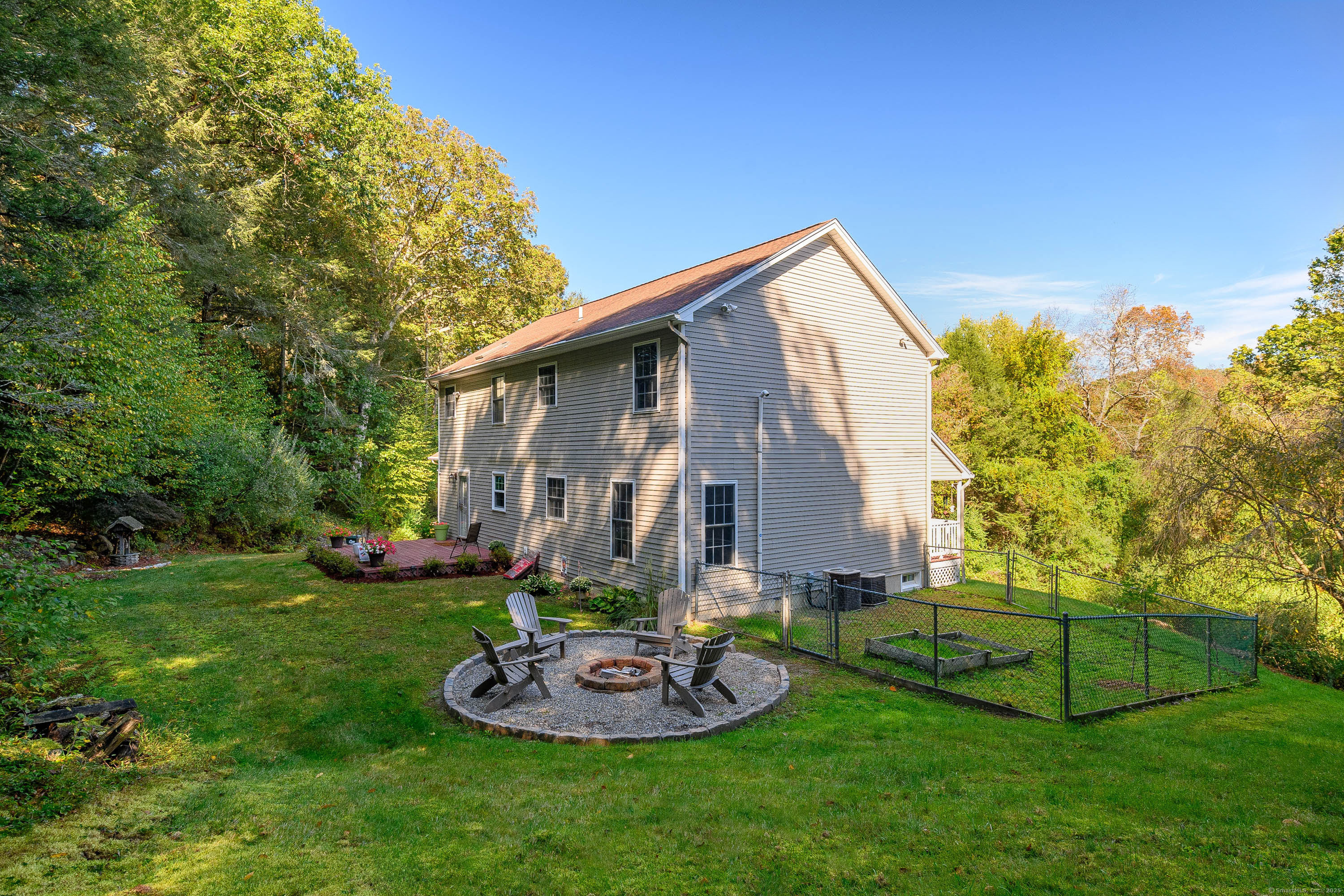 27 Pole Bridge Road Newtown, CT 06482 - Photo 32 of 39 a front view of house with a garden and trees