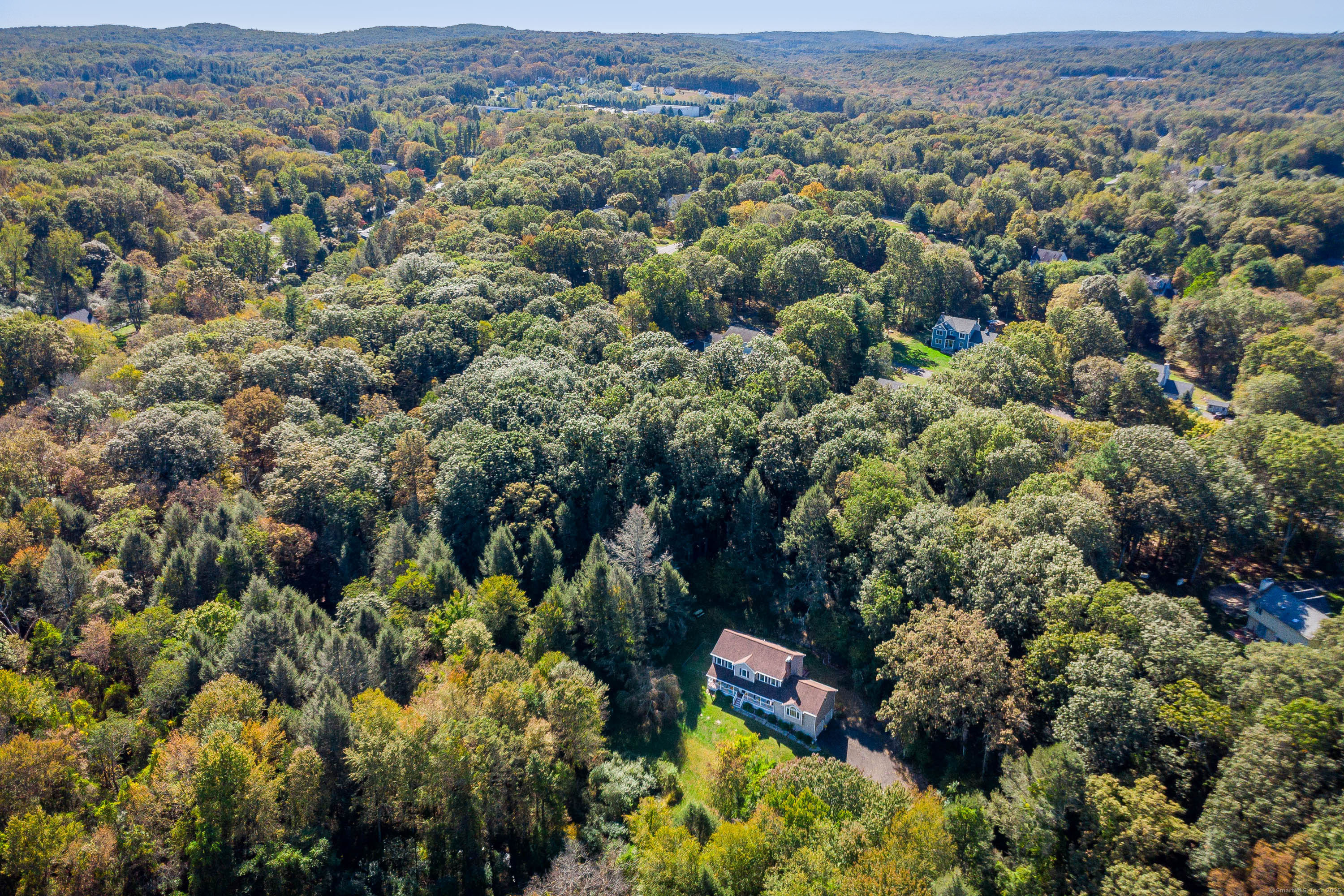 27 Pole Bridge Road Newtown, CT 06482 - Photo 4 of 39 an aerial view of a houses with a lush green hillside