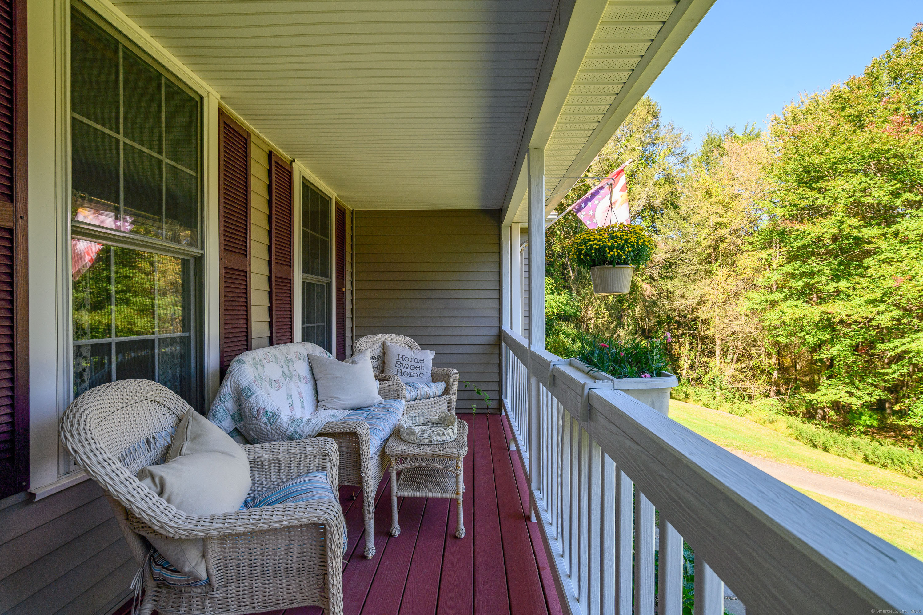 27 Pole Bridge Road Newtown, CT 06482 - Photo 7 of 39 a balcony with table and chairs