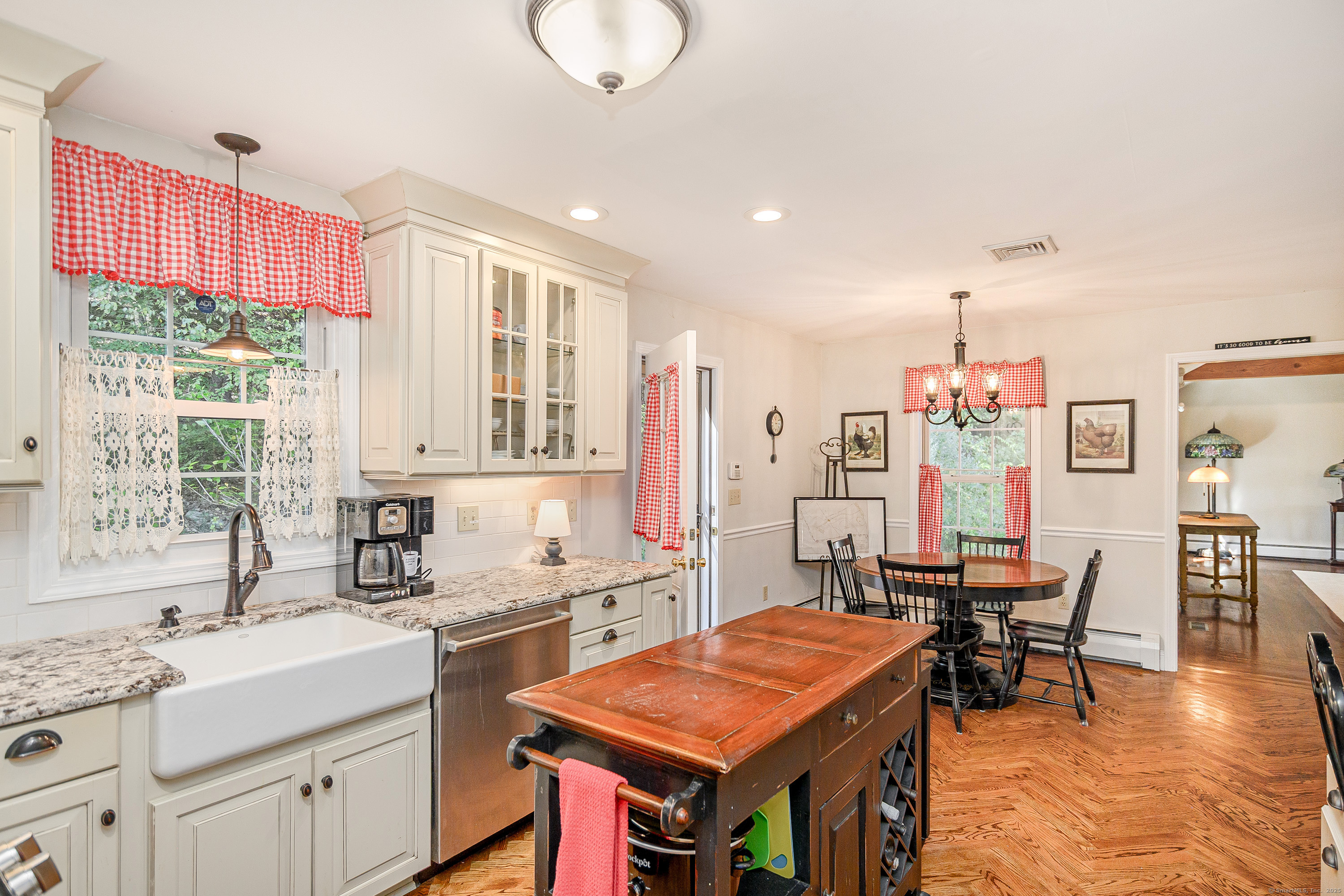 27 Pole Bridge Road Newtown, CT 06482 - Photo 9 of 39 a kitchen that has a table and chairs in it