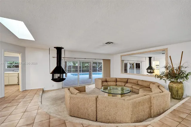 a living room with furniture and a table