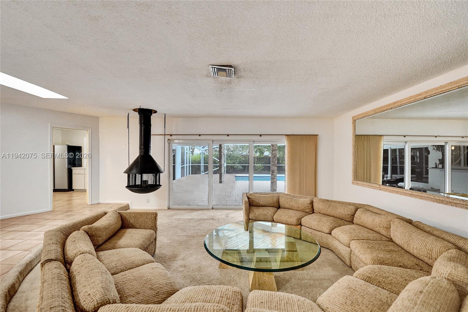 7420 Southwest 13th Street Plantation, FL 33317 - Photo 15 of 68 a living room with furniture and a large window