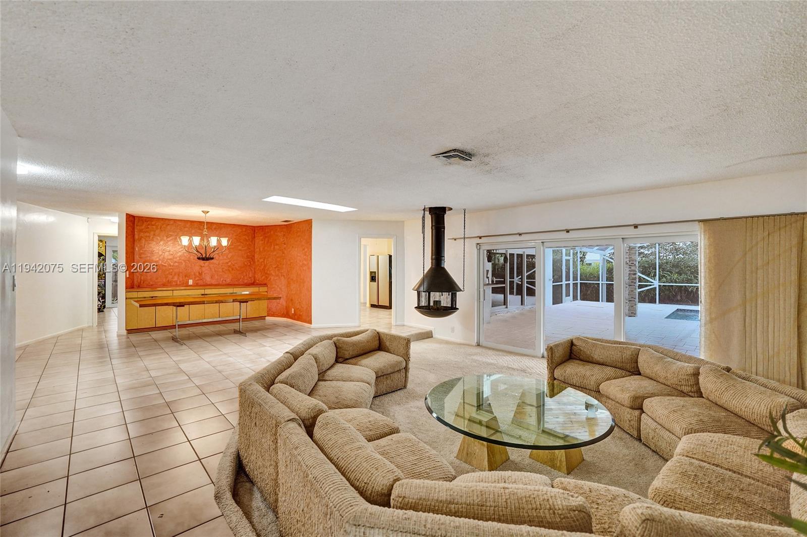 7420 Southwest 13th Street Plantation, FL 33317 - Photo 16 of 68 a living room with furniture and a table