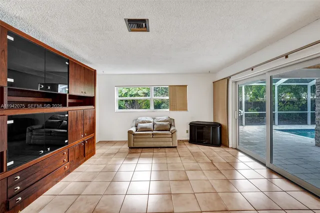 a view of an empty room with a window