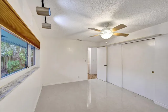 a bathroom with a toilet sink and shower