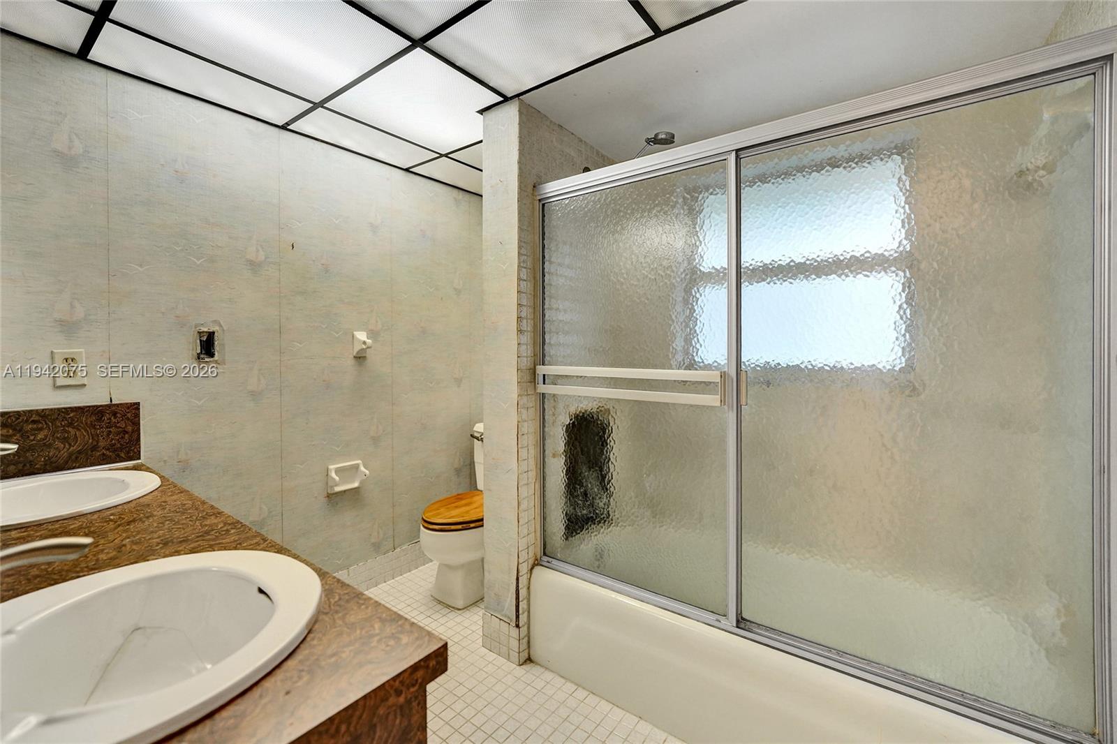 7420 Southwest 13th Street Plantation, FL 33317 - Photo 36 of 68 a bathroom with a tub and a shower